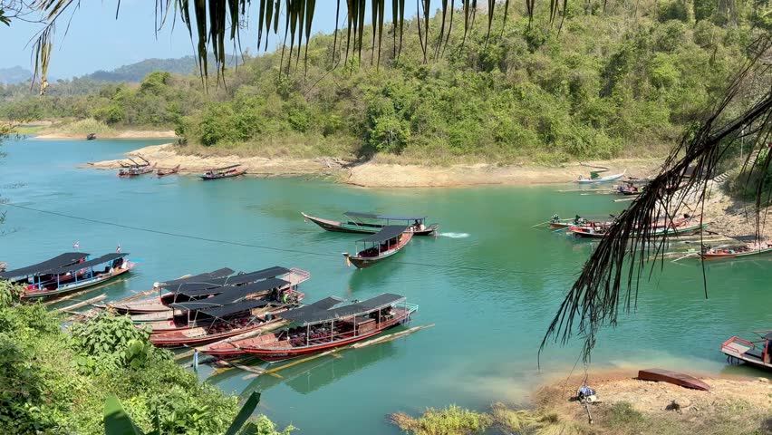 Aerial view of the long tail boats on the water in Khao Sok National Park in Thailand