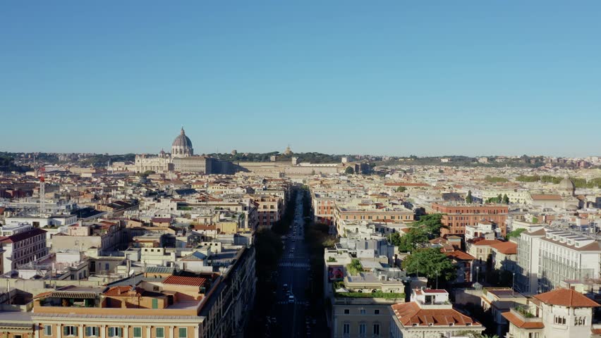Aerial Drone View of Rome Cityscape with St Peter’s Basilica and Vatican Skyline Above Historic Buildings on a Clear Sunny Day. UNESCO World Heritage Site in Italy.