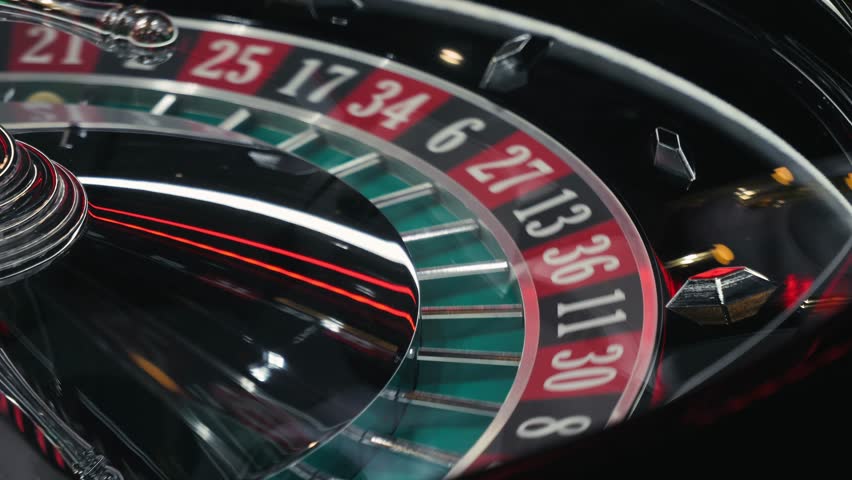 Roulette Wheel Close-up Casino Game with Ball and Numbers, man playing game, gambling and betting. 