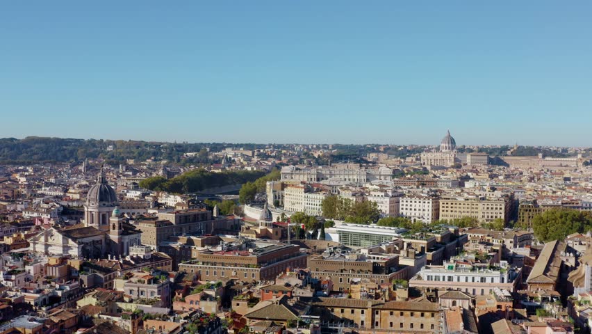 Drone View of Rome Skyline with St Peter’s Basilica and Vatican City. Historic Cityscape with Terracotta Rooftops under Clear Blue Sky in Italy. UNESCO World Heritage Site with Renaissance Charm.