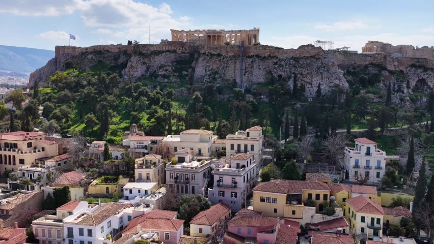 Aerial drone cinematic video of picturesque Plaka district Anafiotika built below Acropolis hill in the heart of Athens historic centre, Attica, Greece