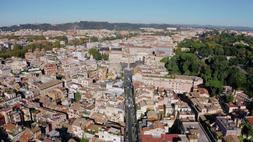 Aerial View of Rome Cityscape with Historic Architecture, Busy Avenue and Dense Rooftops. Drone View of the Italian Capital on Sunny Day. UNESCO World Heritage Site with Renaissance Charm.