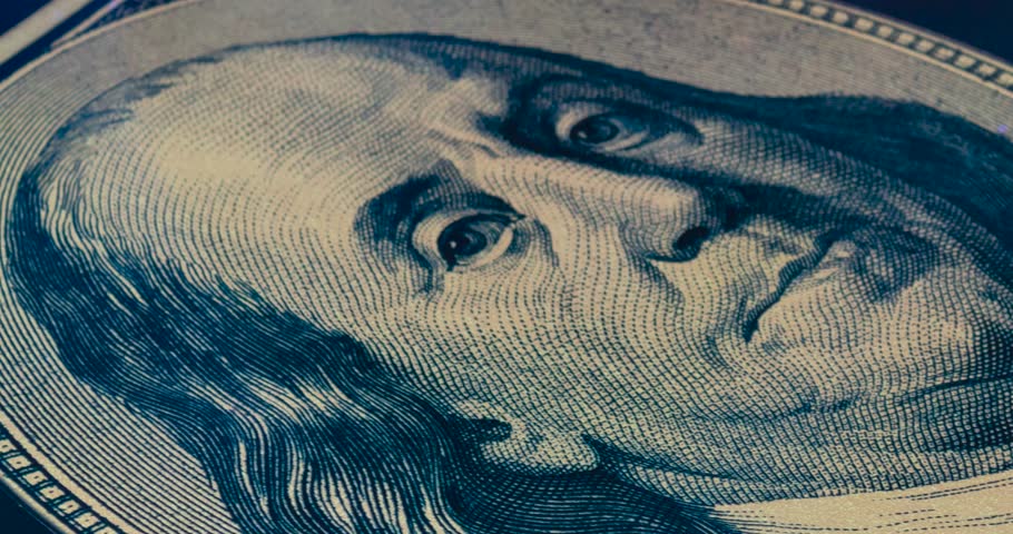 A zoom in to the eye of a Benjamin Franklin portrait poster