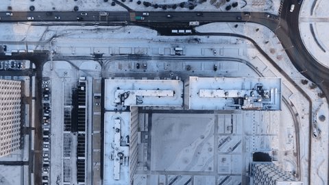 Top Down Drone Flying Backward over Rooftops