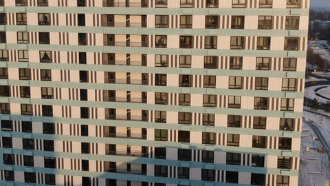 Backward Downward Aerial along Residential Facade