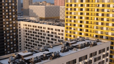 Drone Descending Smoothly along Residential Building Facade
