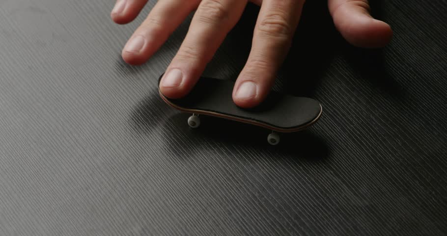 Doing Tricks on Fingerboard Skateboard.  