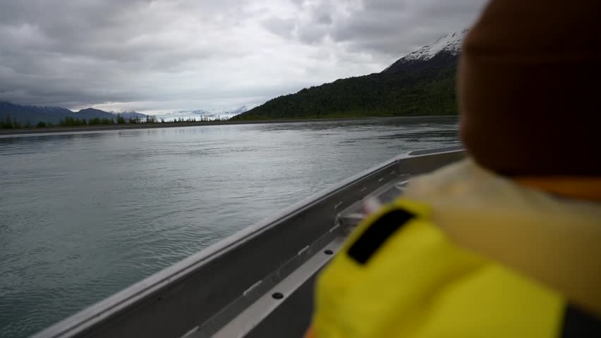 Cinematic handheld POV footage of a small boat navigating through ice chunks and icebergs on Matanuska Glacier in Alaska.  Ideal for dramatic, adventure, relaxing, travel, outdoor, and glacier-themed projects. 