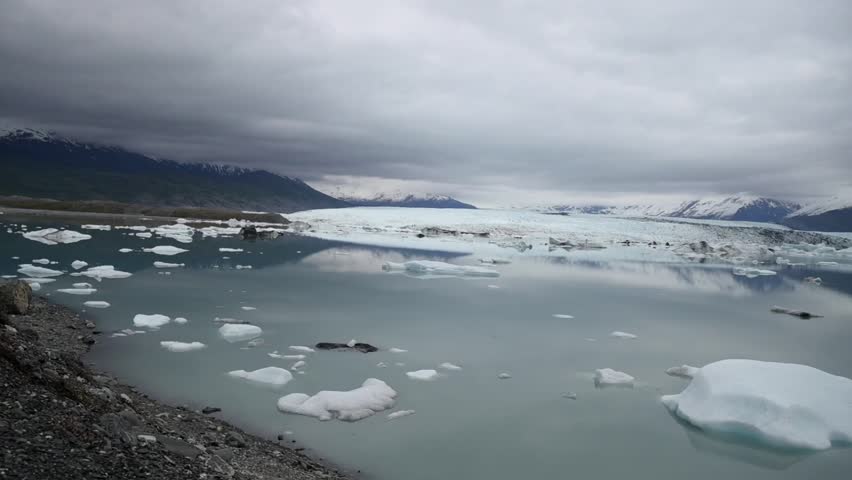 Cinematic handheld POV footage of a small boat navigating through ice chunks and icebergs on Matanuska Glacier in Alaska.  Ideal for dramatic, adventure, relaxing, travel, outdoor, and glacier-themed projects. 