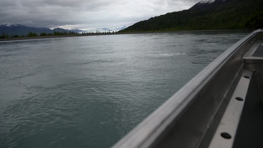 Slow motion cinematic handheld POV footage of a small boat navigating through ice chunks and icebergs on Matanuska Glacier in Alaska.  Ideal for dramatic, adventure, relaxing, travel, outdoor, and glacier-themed projects. 