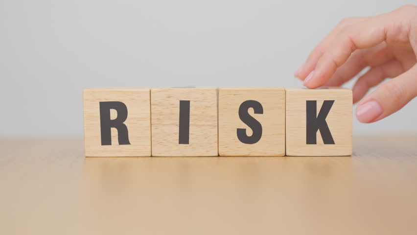 hand change wooden block Rise to Risk. High Risk High Return, strategy, analysis, marketing, risk management, wealth, opportunity and Crisis concepts