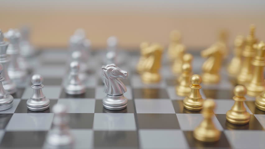 hand moving gold Chess knight figure and Checkmate opponent during chessboard competition. Strategy, Success, management, business planning, win, disruption, Trade war and leadership concept