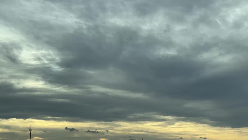 Dramatic storm clouds rolling over wide prairie landscape with open horizon
