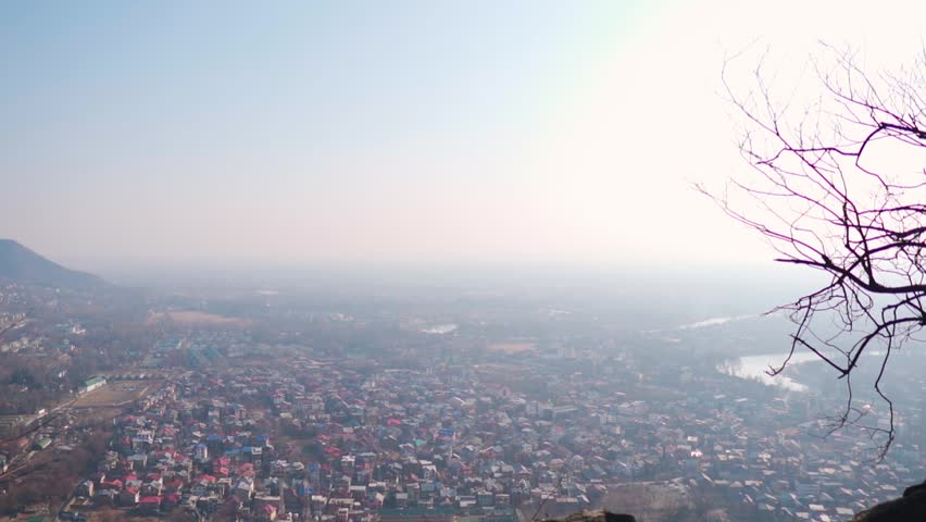 Wide angle shot of Srinagar city as seen from Shri Shankaracharya Temple above the mountain at Srinagar in Jammu and Kashmir, India. Scenic view of the Srinagar city during winter season.
