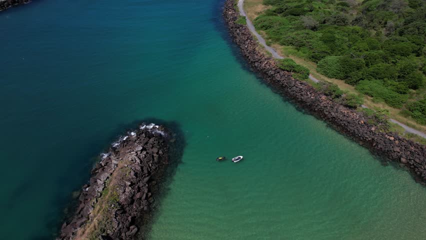 People Swimming At The Secluded Marlo Beach By The Tweed River At Fingal Head In New South Wales, Australia. Aerial Shot