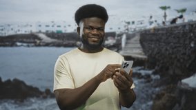 Man tapping smartphone with hands at street pier by the seaside checking messages and scrolling; digital connection focus. - Powered by Shutterstock - Get 15% off with code: PIKWIZARD15