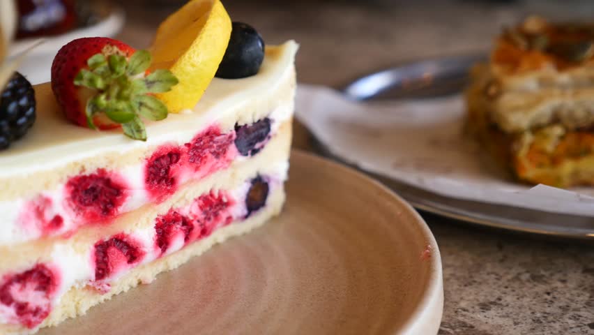 Slice of berry cheesecake on plate, delicious dessert with fresh fruit, sweet treat for breakfast or snack
