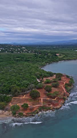 Vertical aerial view of La Isabela archaeological ruins on Caribbean coast in Puerto Plata, Dominican Republic. Historic remains of the first European settlement founded by Christopher Columbus.