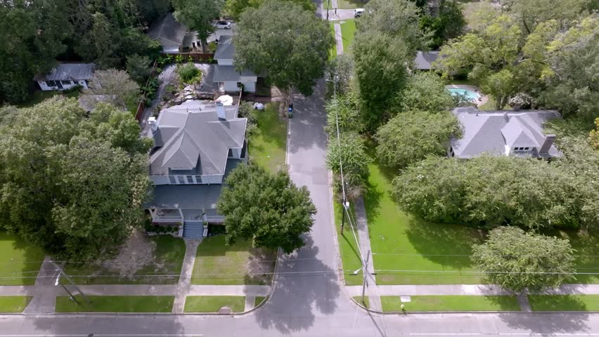 Neighborhood homes in Hattiesburg, Mississippi with drone video moving left to right.