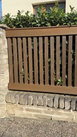 Wooden fence in front of the house