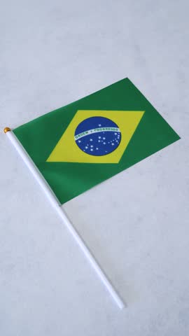 Flag of Brazil on white background. Vertical shot. South America flag.