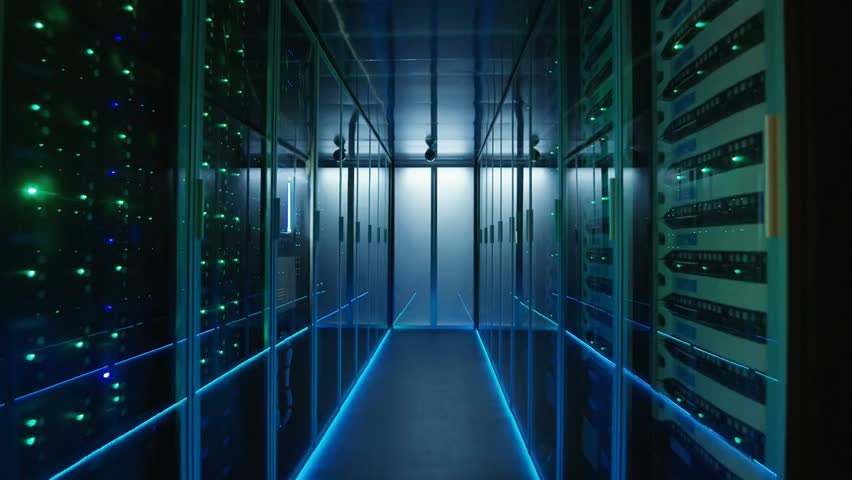 Wide moving shot of a modern data center hallway filled with server racks, showcasing high-tech infrastructure, cloud computing, and digital storage systems.