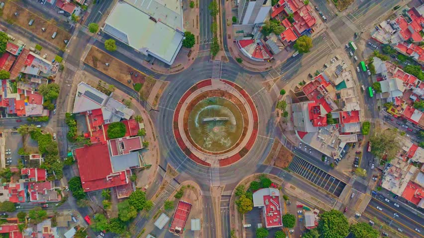 Overhead drone shot of Glorieta Minerva roundabout and urban layout in Guadalajara, Mexico