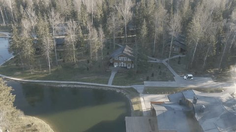 Aerial Approach Lakeside Wooden House