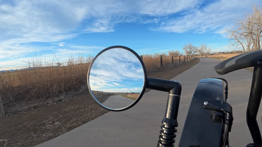 Immersive POV from recumbent trike ride on bike trails in Boyd Lake State Park, Colorado, with rear mirror view