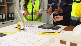 Engineer teams meeting working together wear worker helmets hardhat on construction site. Asian industry professional team. - Powered by Shutterstock - Get 15% off with code: PIKWIZARD15