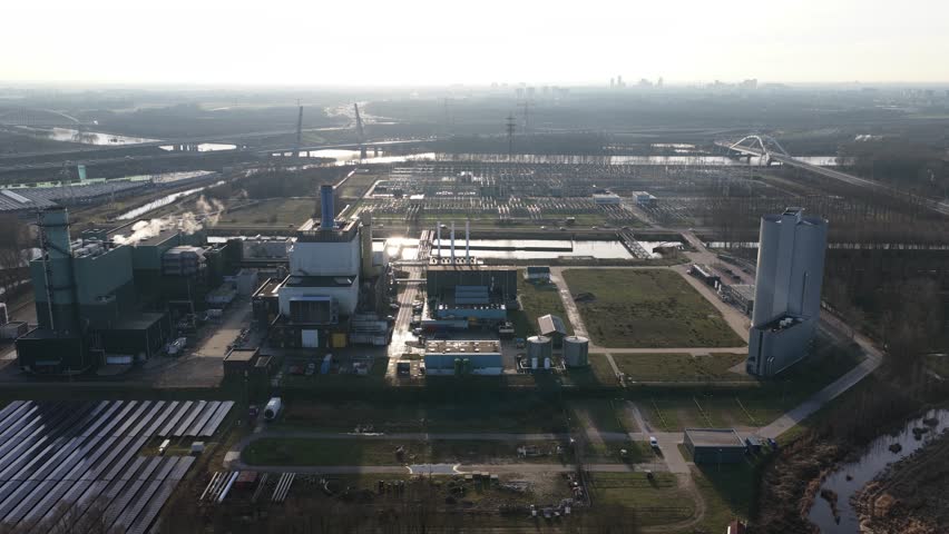 Aerial view of a modern power plant with solar panels