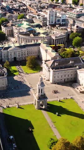 Trinity College and Main Street in Dublin City Centre. Beautiful sunny evening in Ireland. Aerial vertical
