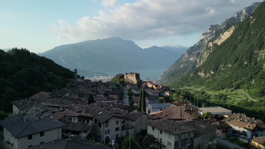 Drone aerial view of Tenno village and Castello di Tenno overlooking Lake Garda near Riva del Garda in northern Italy.