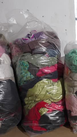 Baled used kids clothing for recycling and reuse