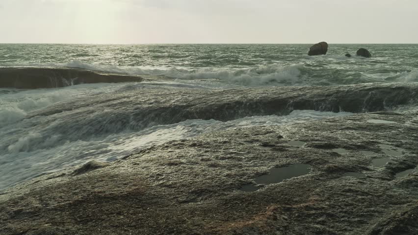 Sea waves over big rocks