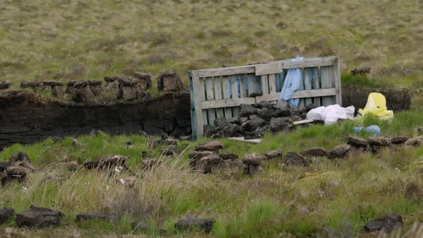 Peat turf stacked on a traditional, Hebridean peat bank on the Isle of Lewis.