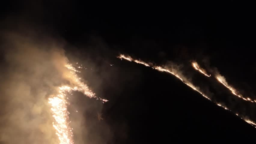 fire flames and smoke from brush fire in the sampson community near boone nc, north carolina