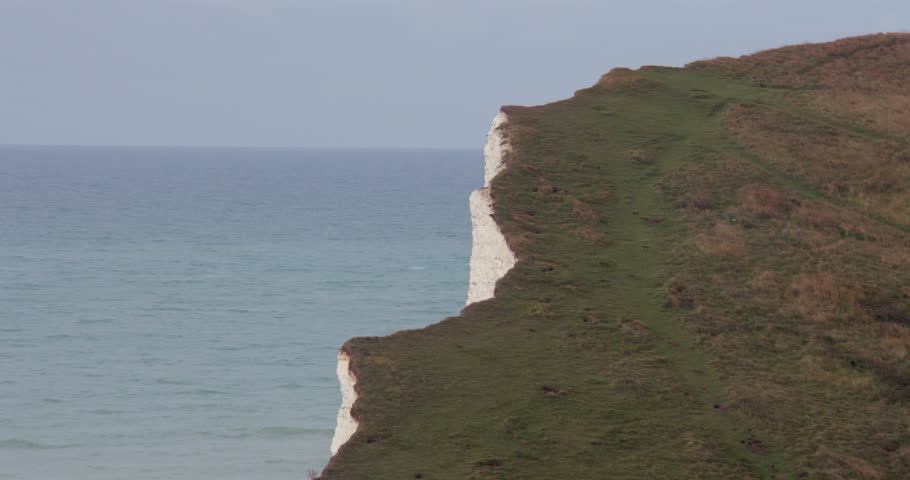 Wide shot of the edge of the white cliffs at Seaford head next to Seven Sisters cliffs
