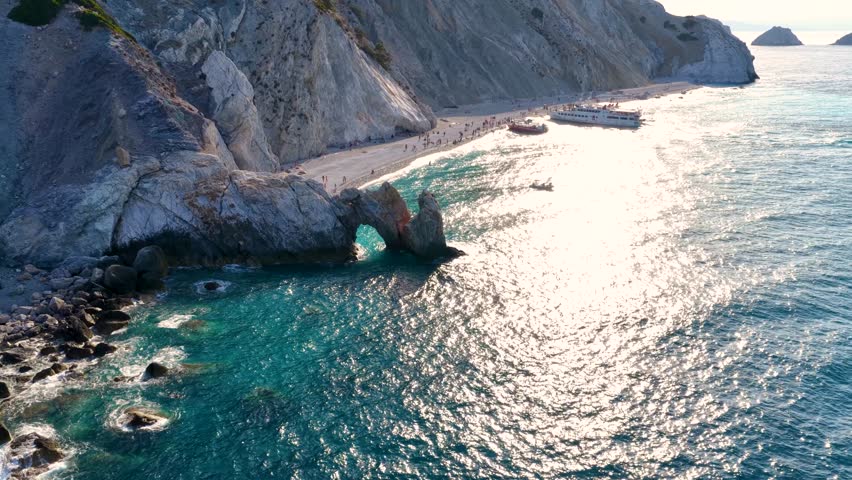 Aerial view of the beautiful beach of Lalaria with shining, turquoise sea during sunset time, Skiathos island, Sporades, Greece