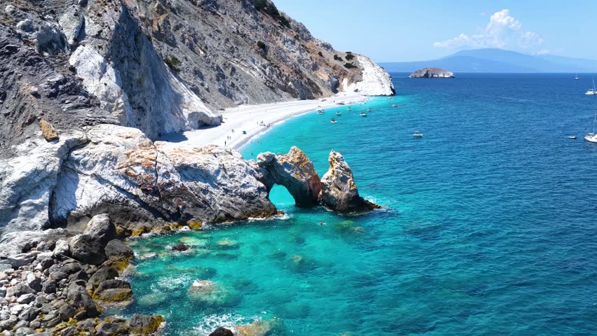 Aerial view of the beautiful Lalaria beach at Skiathos Island, Sporades, Greece, with the natural rock arch and turquoise shining sea