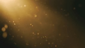 Golden light particles floating on dark - Powered by Shutterstock - Get 15% off with code: PIKWIZARD15