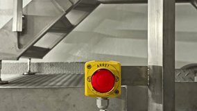 Emergency stop button on industrial machinery, ensuring safety in production - Powered by Shutterstock - Get 15% off with code: PIKWIZARD15