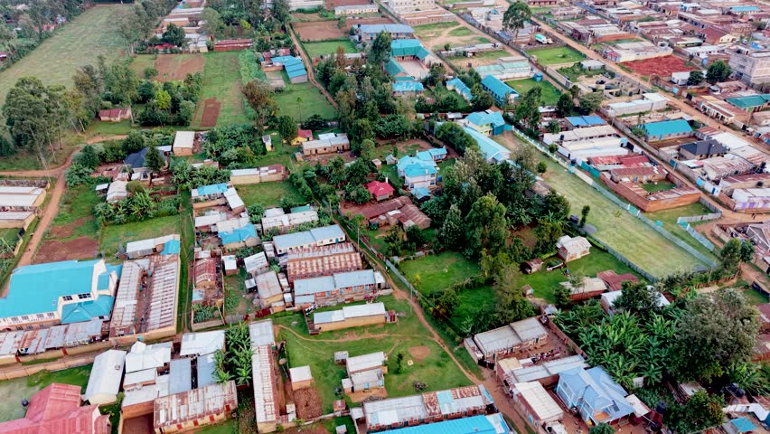 Rural cityscape kenya city skyline. Rural village of kenya. Aerial drone rural towns of kenya- slums . Sunset view of the small village in kenya. Roads of kenya.