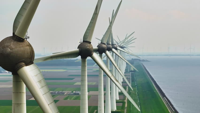 Aerial view of offshore windmill park with blue sky, windmill park in the sea, aerial view of wind turbine, Netherlands