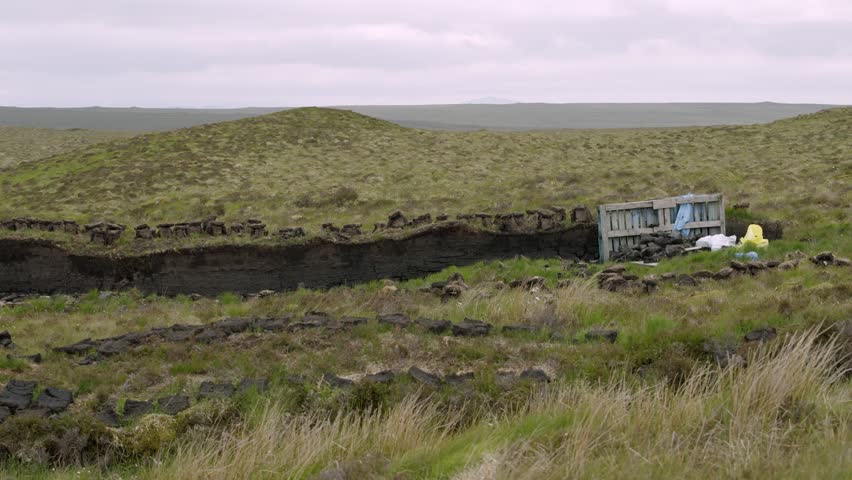Peat stacked on a traditional peat bank on the Hebrides.