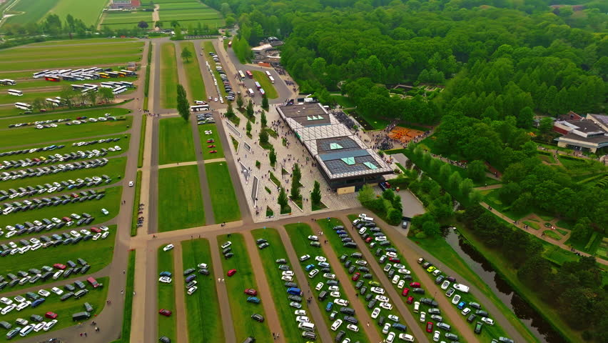 Aerial view of famous Keukenhof windmill. Colorful tulips on sunny day at the Keukenhof flower garden, Lisse, The Netherlands