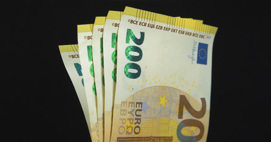 Euro banknotes, EUR. New green two hundred Euro banknotes. European Money. Cash, finance, savings, wealth. One thousand Euros in five 200 euro banknotes