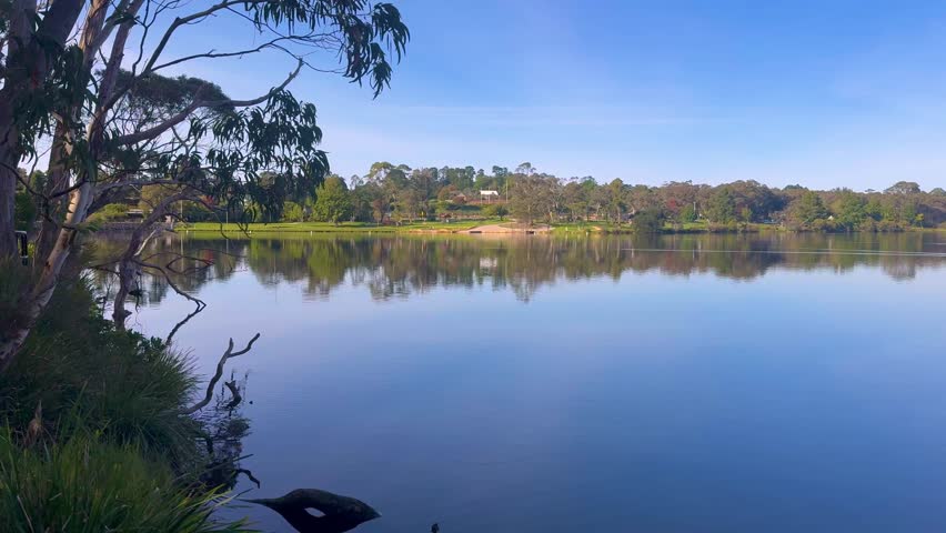 Panoramic footage of Wentworth Falls Lake and the surrounding shoreline forest in the Blue Mountains town of Wentworth Falls in New South Wales, Australia