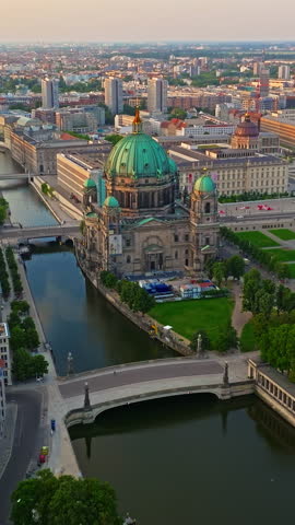  Aerial view of Famous Berlin cathedral at sunrise with famous television tower is in the background. Berlin, Germany