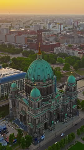  Aerial view of Famous Berlin cathedral at sunrise with famous television tower is in the background. Berlin, Germany